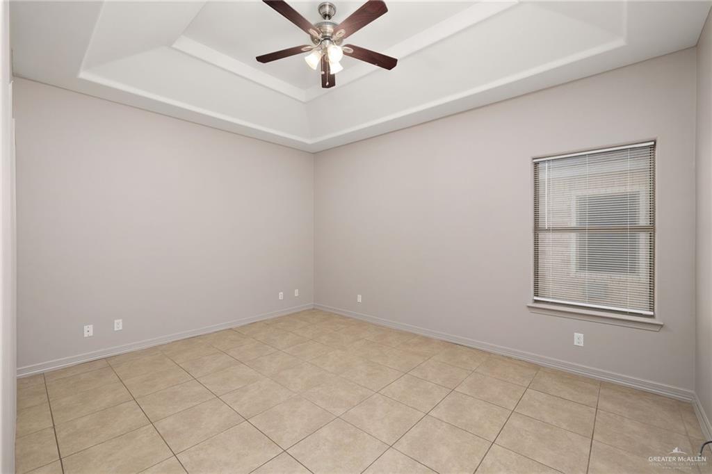 1214 Cornerstone Loop Rio Grande City, TX 78582 - Photo 8 of 15 an empty room with windows and fan