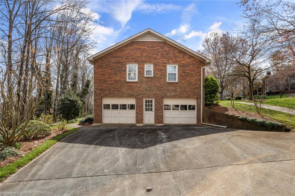 1393 Turkey Hill Road Winston-Salem, NC 27106 - Photo 30 of 36 Two car garage - is oversized with workbench & great storage