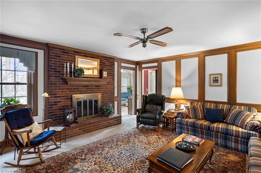 1393 Turkey Hill Road Winston-Salem, NC 27106 - Photo 8 of 36 Den with gas log fireplace opens onto Sunroom