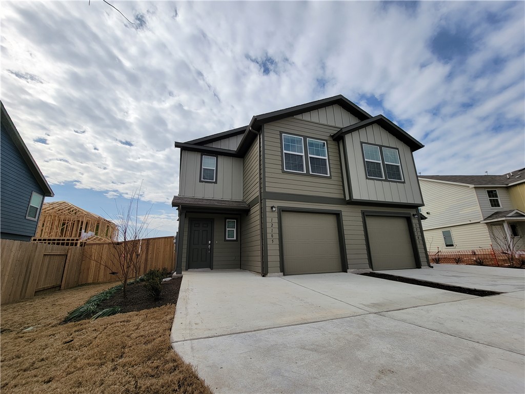 12105 Short Leaf Path Del Valle, TX 78617 - Photo 1 of 1 a front view of a house with wooden fence