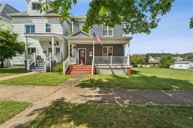 a front view of a house with a yard