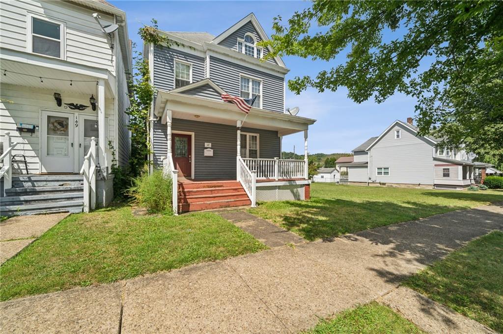 147 Hamilton Avenue Vandergrift, PA 15690 - Photo 2 of 32 a front view of a house with a yard and fence