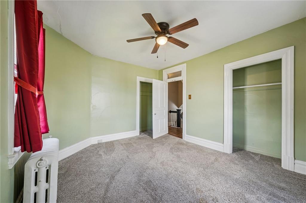 147 Hamilton Avenue Vandergrift, PA 15690 - Photo 27 of 32 a view of a room with closet and wooden floor