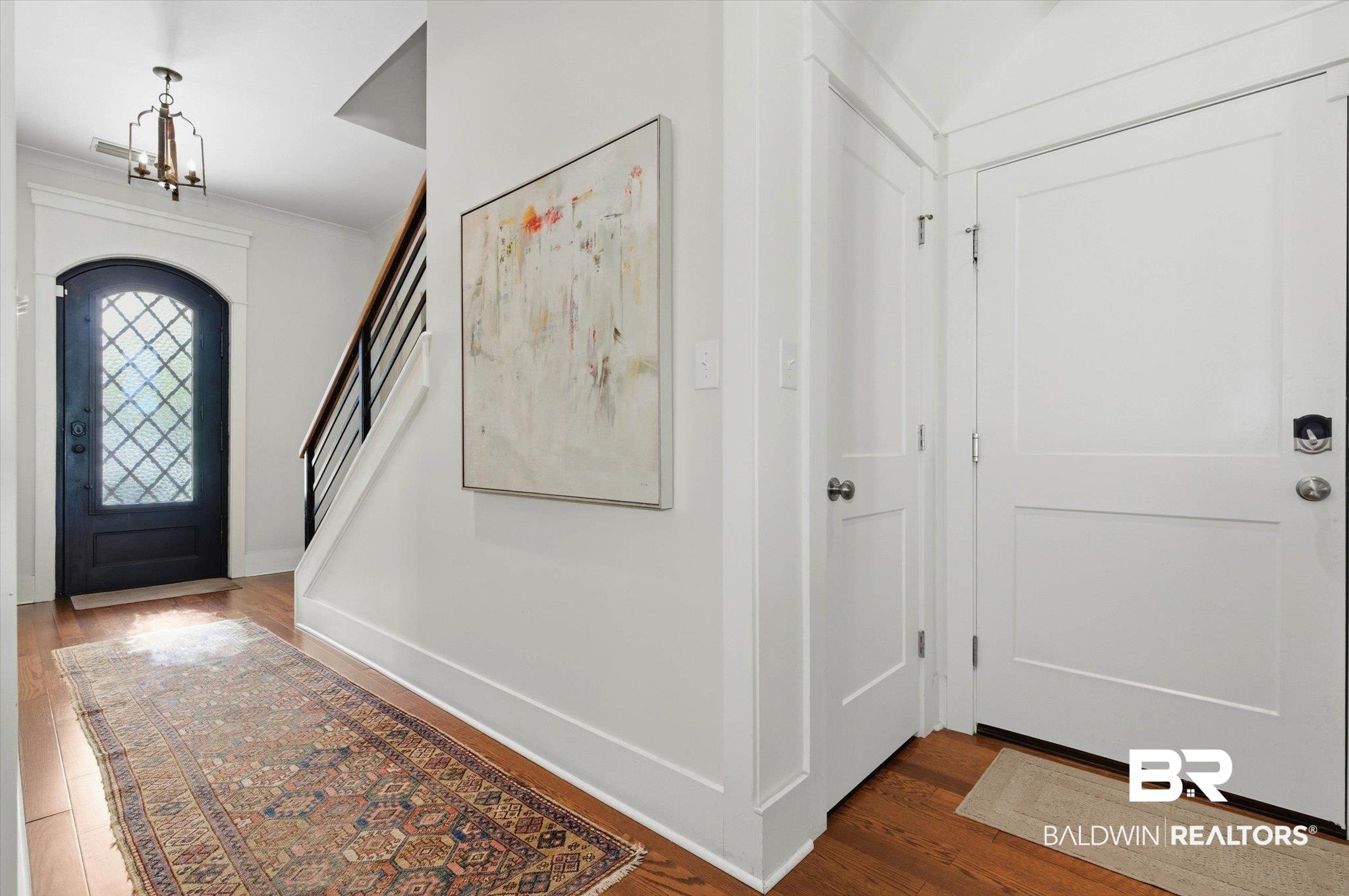 3704 Stein Street Mobile, AL 36608 - Photo 6 of 37 Foyer featuring dark wood-style floors, stairs, and a chandelier