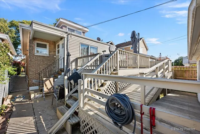 a view of a house with pool and deck