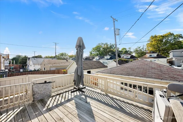 a view of a balcony with yard