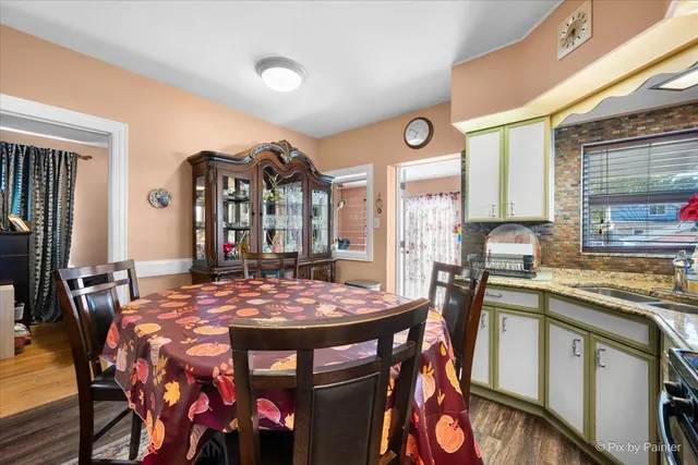 a view of a dining room with furniture and window
