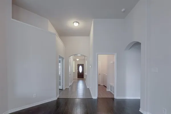 a hallway with wooden floor