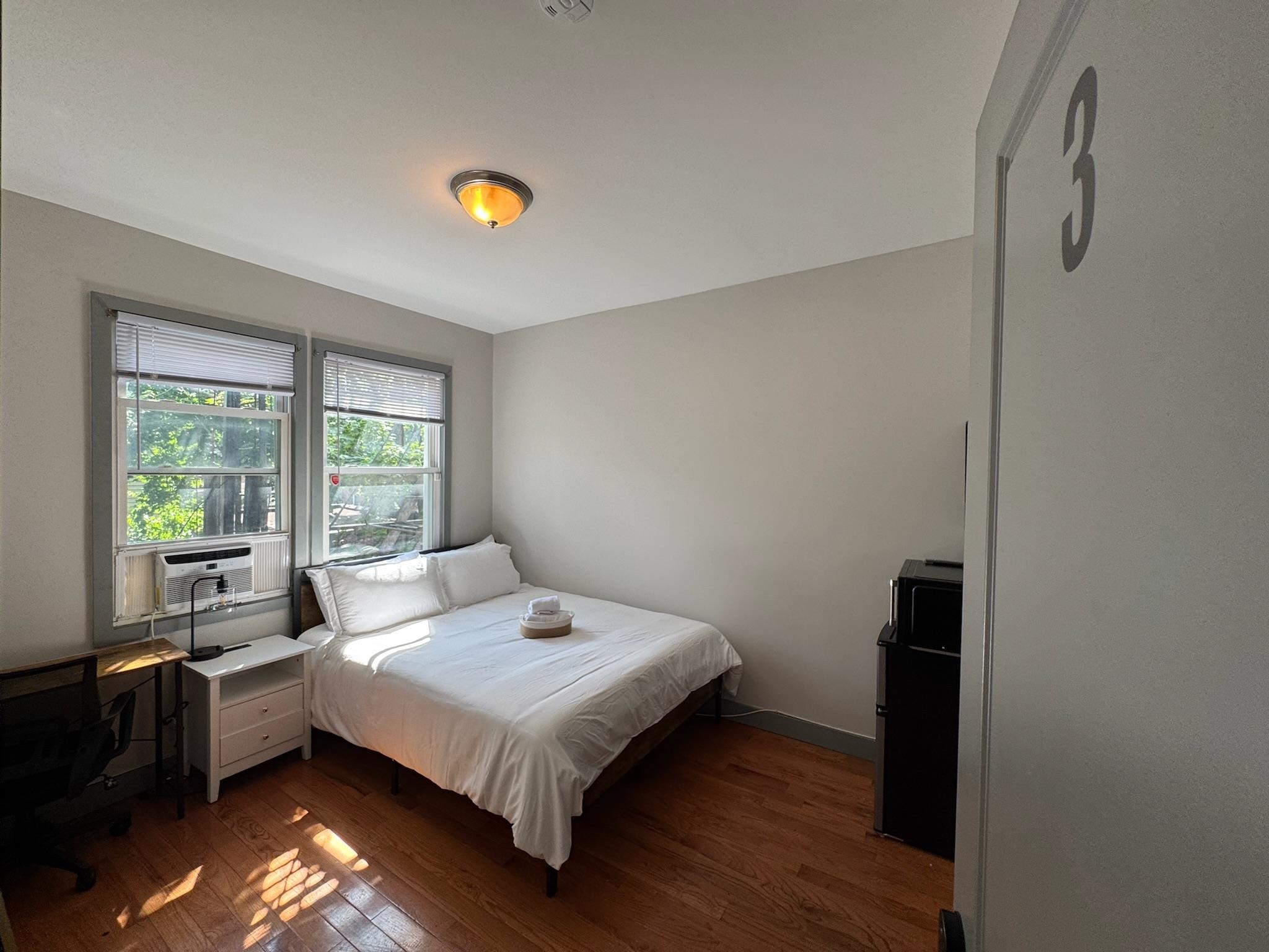 157 Bidwell Avenue, Unit 2 Jersey City, NJ 07305 - Photo 13 of 34 a bedroom with a bed and a window