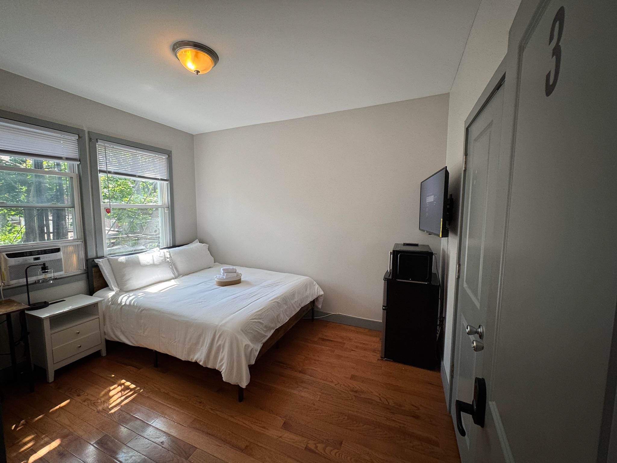 157 Bidwell Avenue, Unit 2 Jersey City, NJ 07305 - Photo 21 of 34 a bedroom with a bed and a window