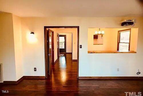 105 Lantern Way Carrboro, NC 27510 - Photo 6 of 9 a view of an empty room with wooden floor and a window