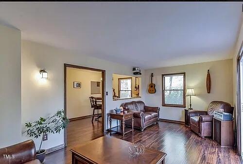 105 Lantern Way Carrboro, NC 27510 - Photo 8 of 9 a living room with furniture and wooden floor