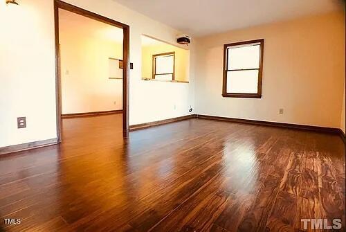 105 Lantern Way Carrboro, NC 27510 - Photo 9 of 9 a view of an empty room with wooden floor and a window