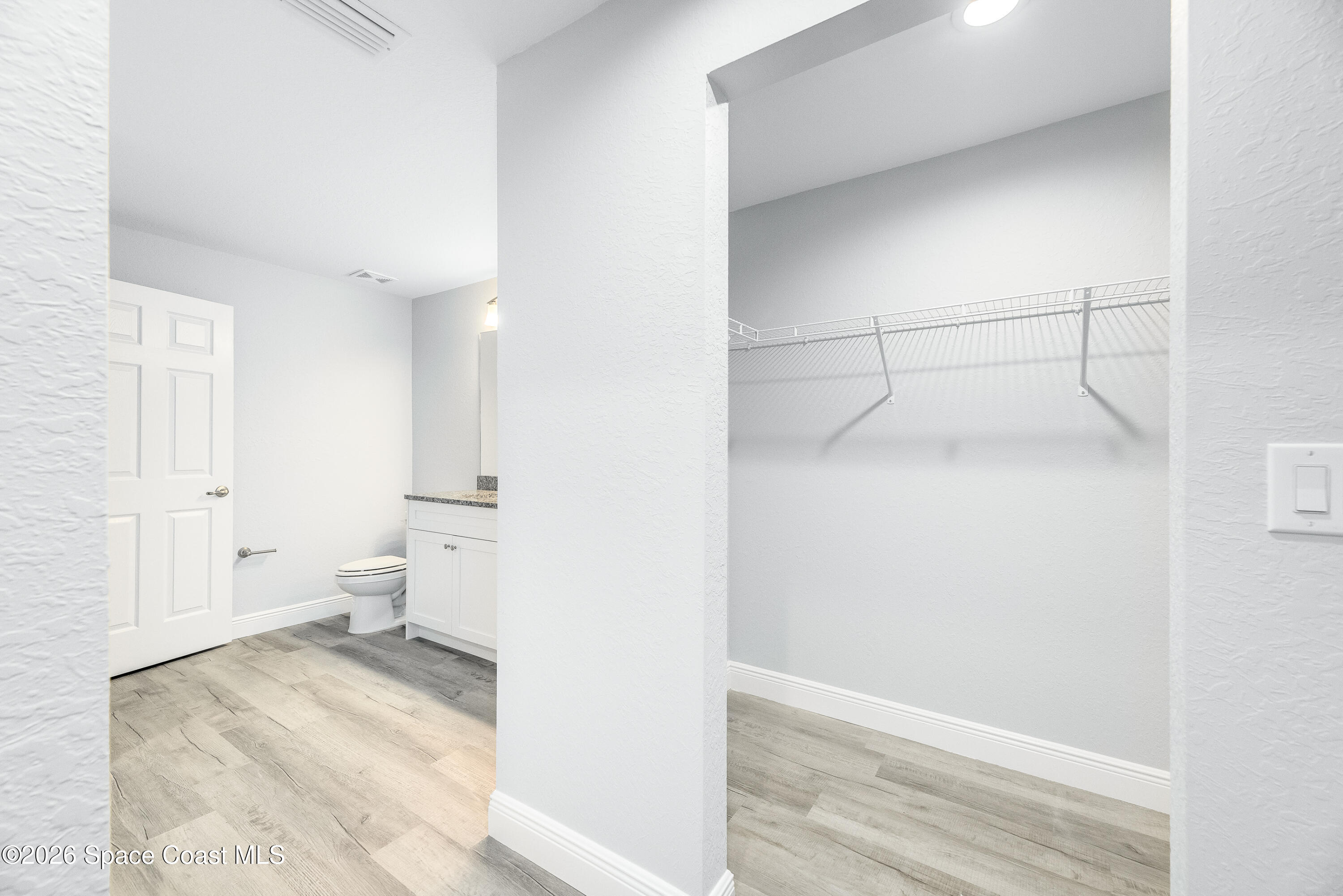 2977 Fig Road Southeast Palm Bay, FL 32909 - Photo 23 of 38 a view of a room with wooden floor
