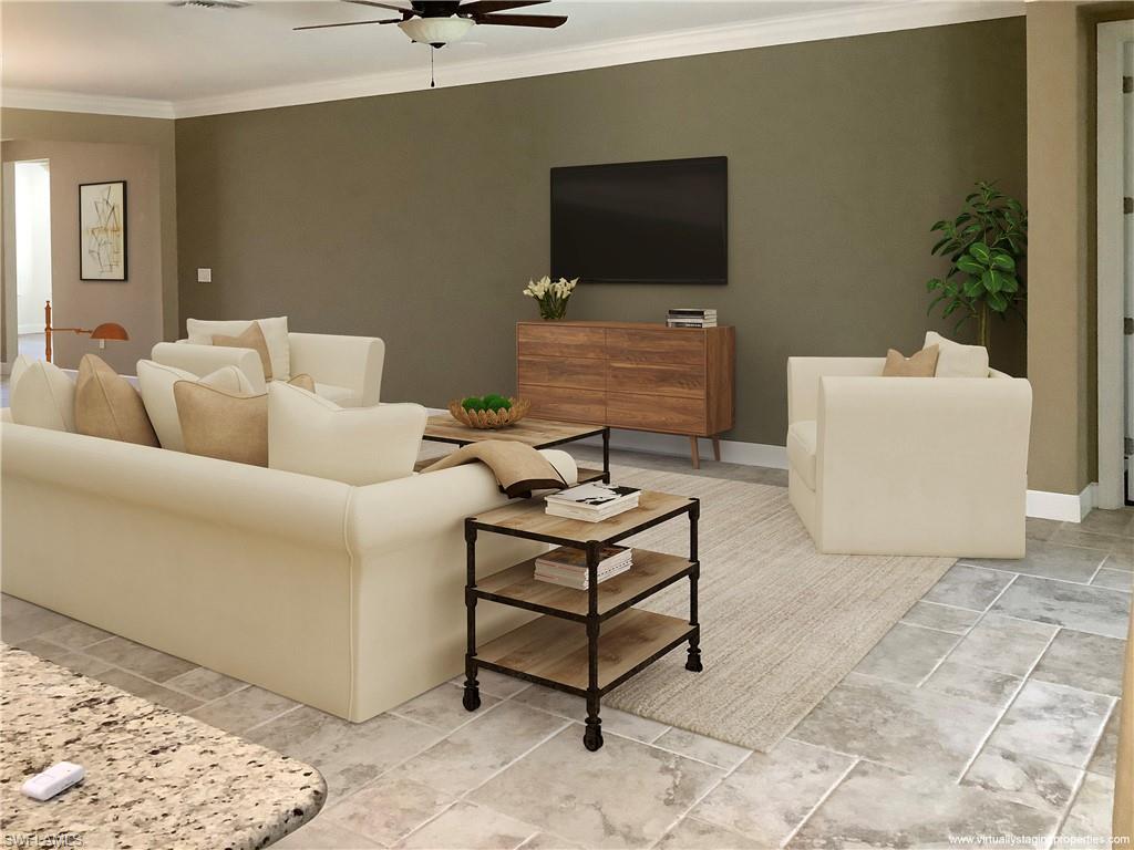 10840 Rutherford Road Fort Myers, FL 33913 - Photo 5 of 35 Living room with ceiling fan and crown molding