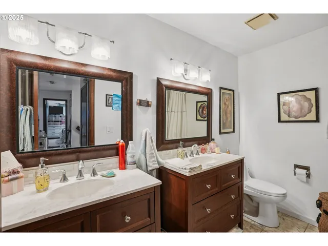 a bathroom with a sink vanity and a mirror