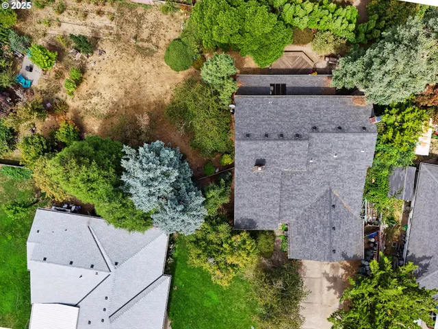 an aerial view of house with a yard