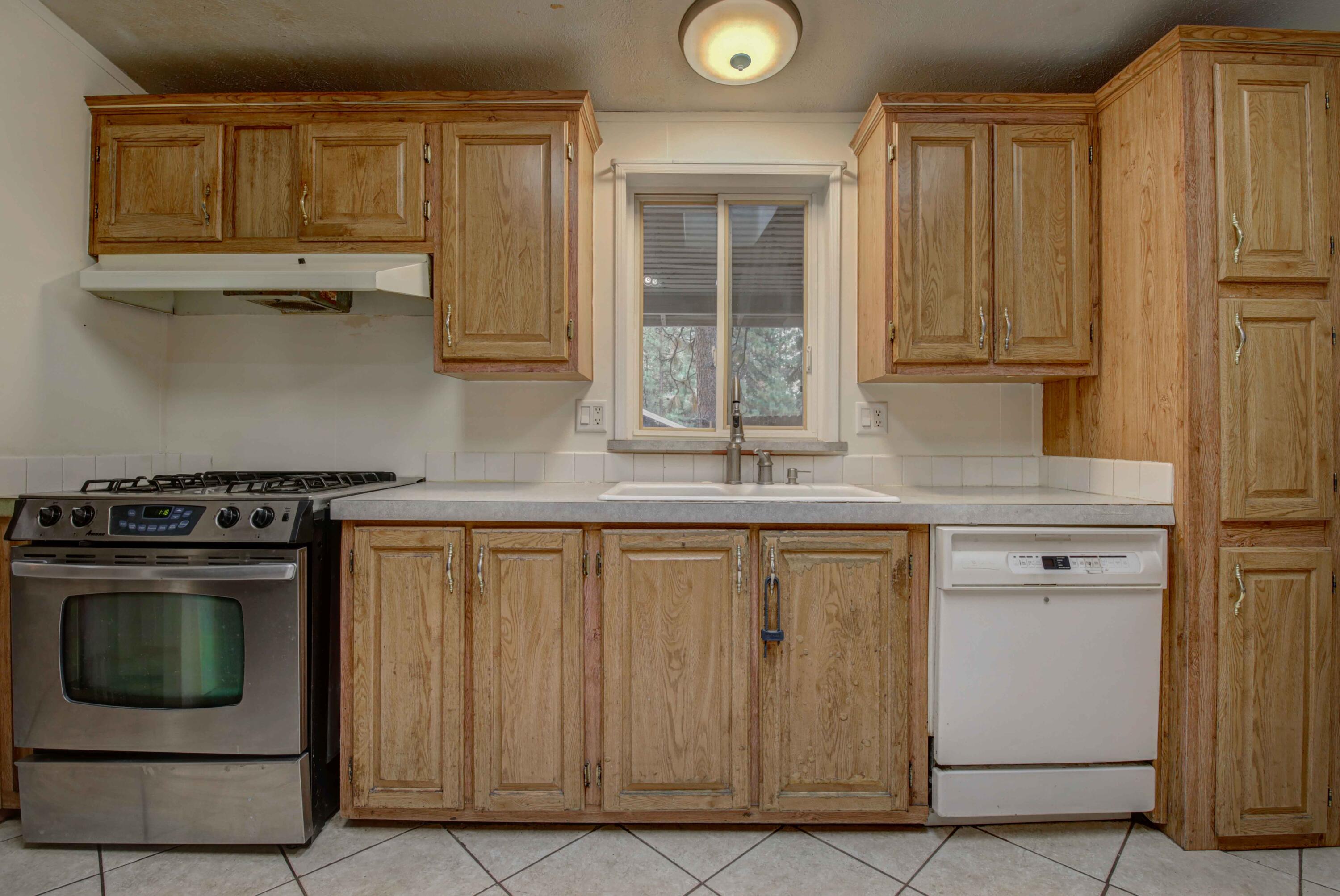 60184 Crater Road Bend, OR 97702 - Photo 9 of 29 Kitchen features stainless propane gas range/oven.