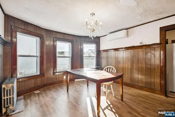a view of a room with furniture window and wooden floor