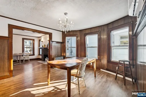 a view of a dining room with furniture and window