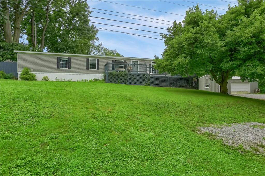 4425 State Rte 18 New Castle, PA 16102 - Photo 1 of 22 a front view of a house with garden