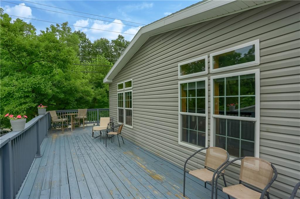 4425 State Rte 18 New Castle, PA 16102 - Photo 16 of 22 a balcony with wooden floor table and chairs