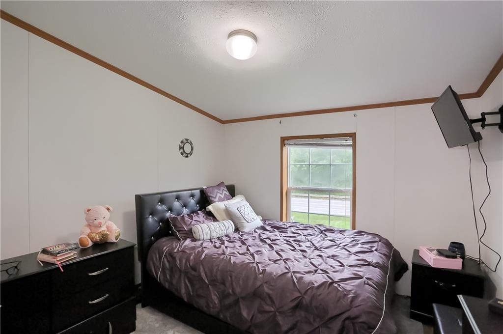 4425 State Rte 18 New Castle, PA 16102 - Photo 9 of 22 a bedroom with a bed and window