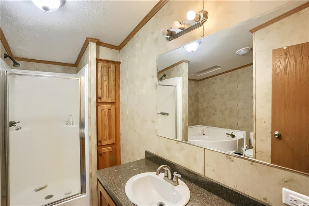 4425 State Rte 18 New Castle, PA 16102 - Photo 10 of 22 a bathroom with a sink mirror toilet and bathtub