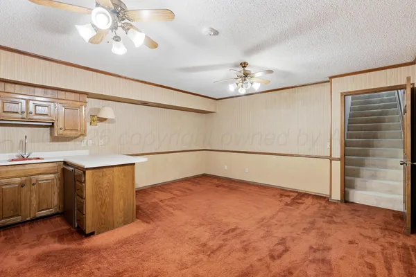 a view of kitchen with cabinets and wooden floor