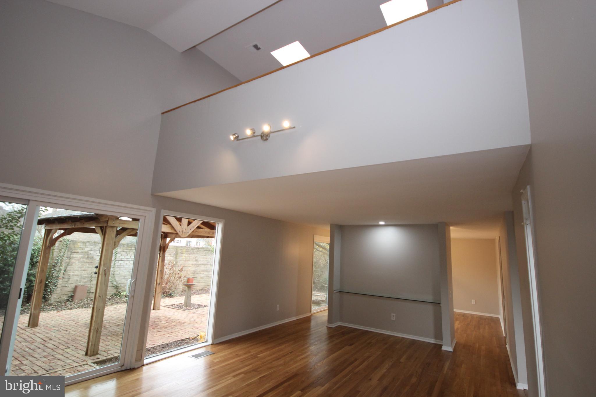 19115 Roman Way Montgomery Village, MD 20886 - Photo 21 of 67 a view of empty room with wooden floor