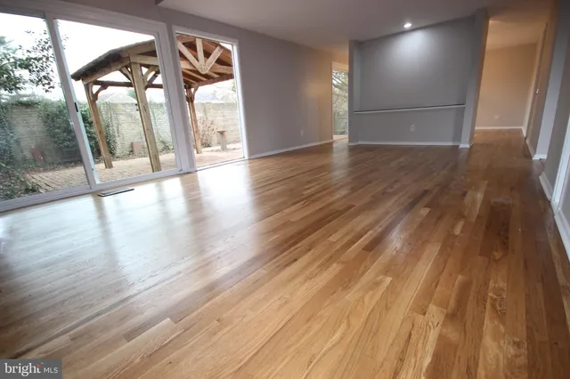 a living room with a fireplace and a rug