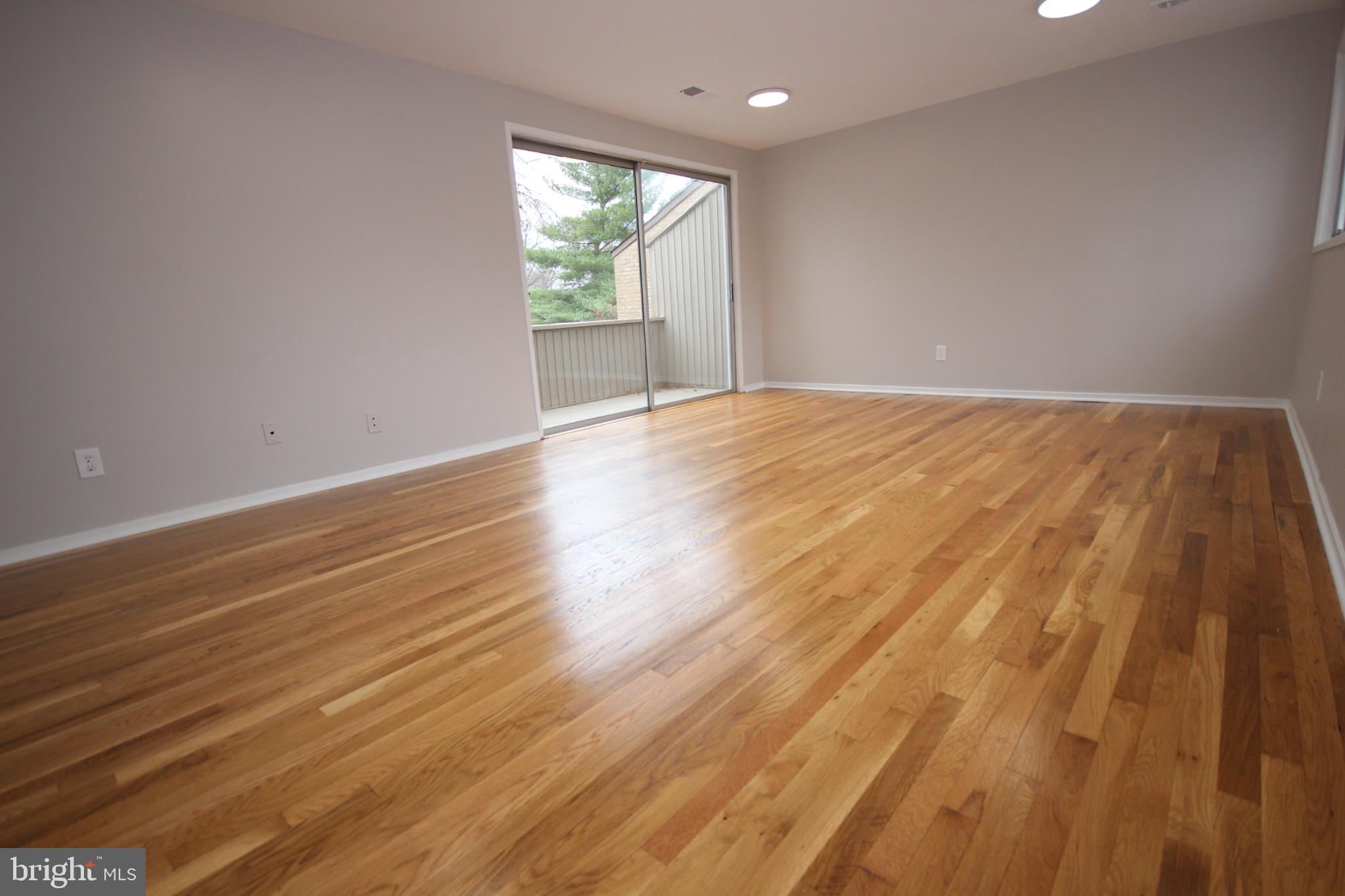 19115 Roman Way Montgomery Village, MD 20886 - Photo 39 of 67 wooden floor in an empty room with a window