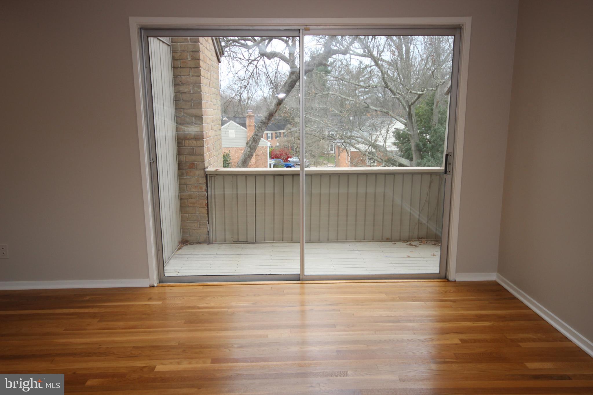 19115 Roman Way Montgomery Village, MD 20886 - Photo 43 of 67 a view of a room with wooden floor and a window