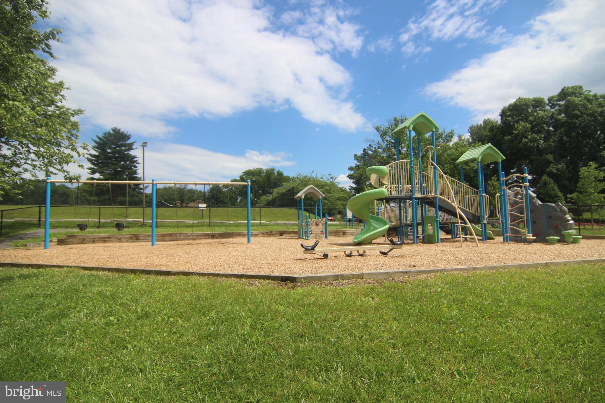 19115 Roman Way Montgomery Village, MD 20886 - Photo 64 of 67 a view of a park with swings and slides