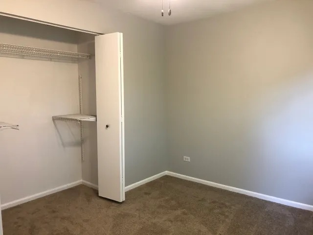 627 South Virginia Road, Unit 312 Crystal Lake, IL 60014 - Photo 11 of 13 an empty room with a door