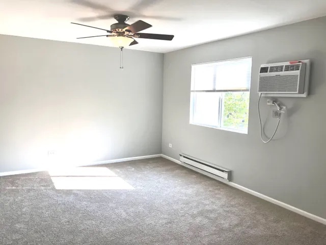 627 South Virginia Road, Unit 312 Crystal Lake, IL 60014 - Photo 12 of 13 an empty room with a window and a fan