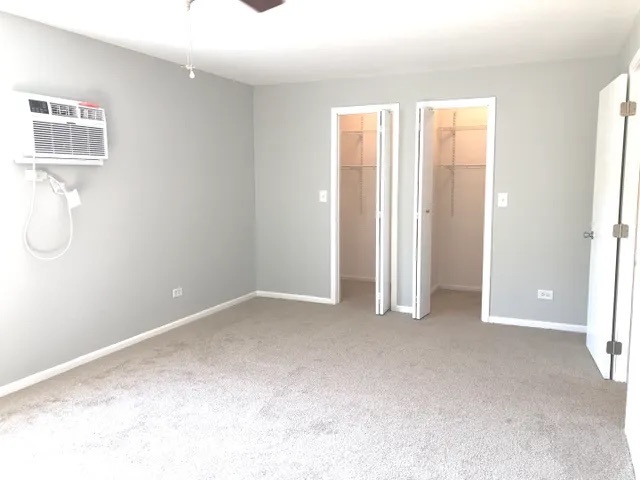 627 South Virginia Road, Unit 312 Crystal Lake, IL 60014 - Photo 13 of 13 an empty room with windows