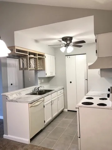 627 South Virginia Road, Unit 312 Crystal Lake, IL 60014 - Photo 5 of 13 a kitchen with stainless steel appliances granite countertop a sink stove and refrigerator