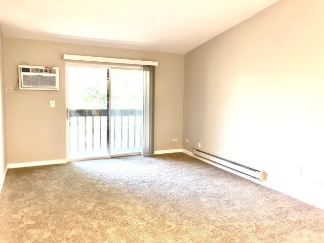 627 South Virginia Road, Unit 312 Crystal Lake, IL 60014 - Photo 7 of 13 a view of an empty room with a window