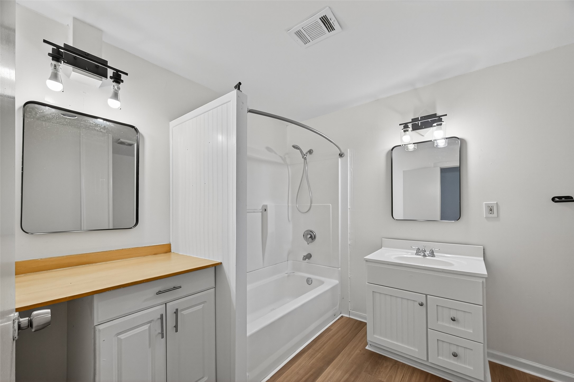 105 Clear Lake Road, Unit A Highlands, TX 77562 - Photo 16 of 25 a bathroom with a sink double vanity granite tub shower and a mirror