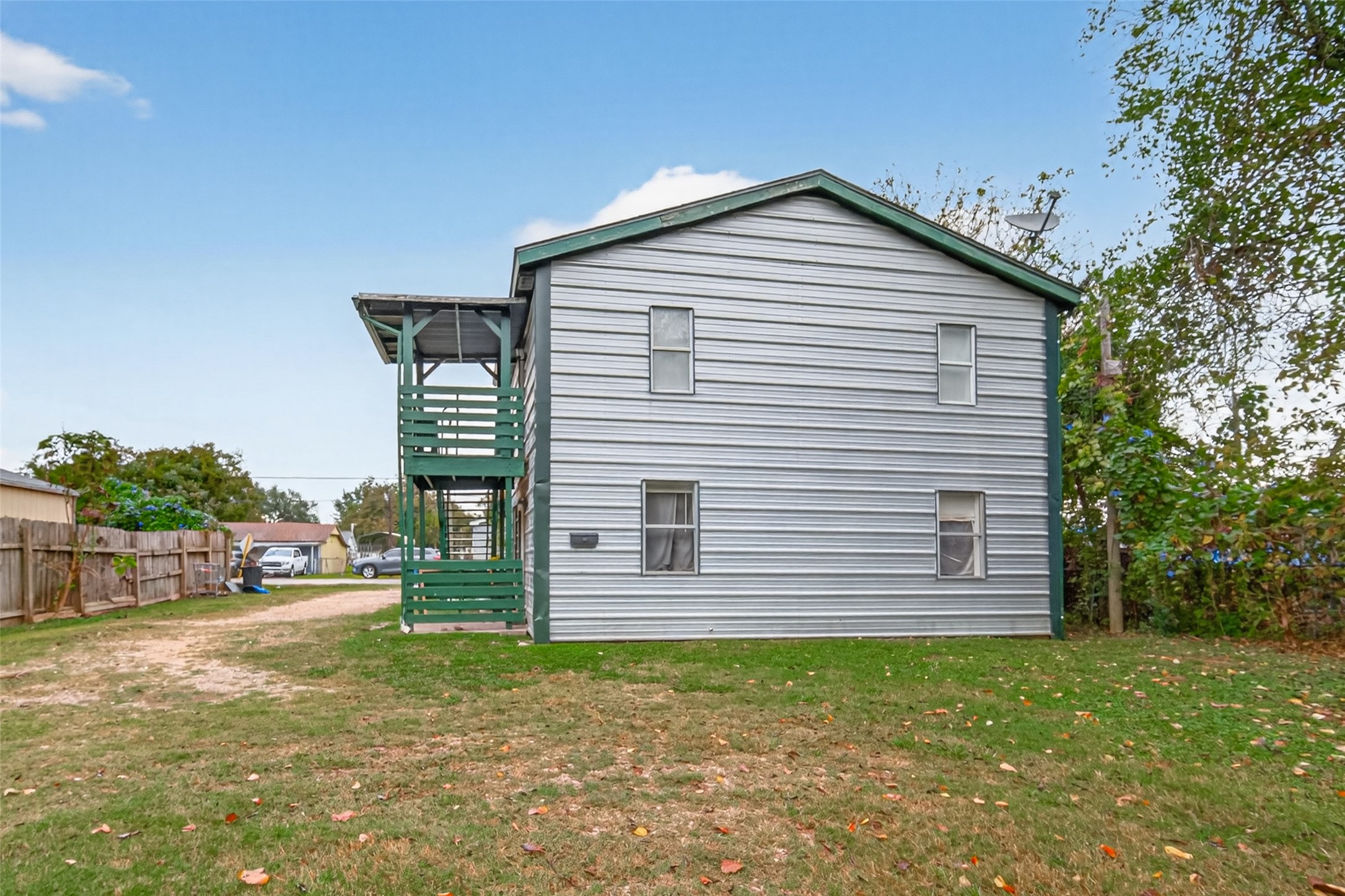 105 Clear Lake Road, Unit A Highlands, TX 77562 - Photo 24 of 25 a front view of a house with a garden