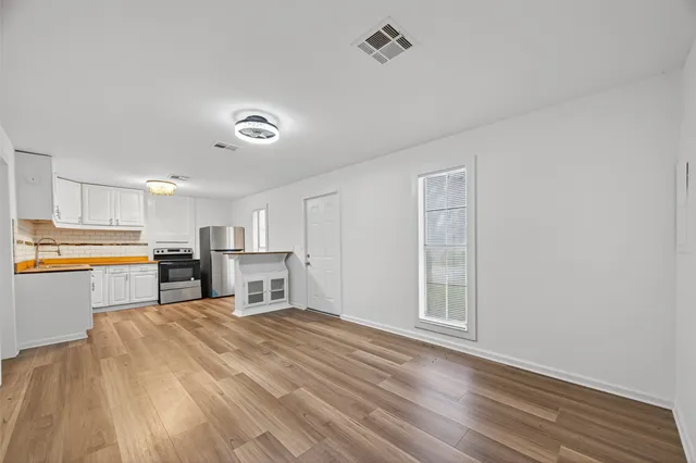 a view of a kitchen with a sink cabinets and a window