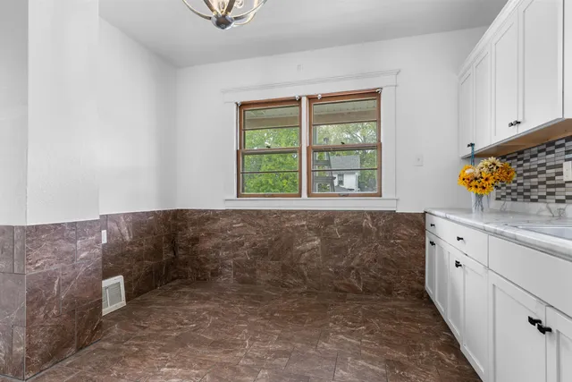 a bathroom with a bathtub and window