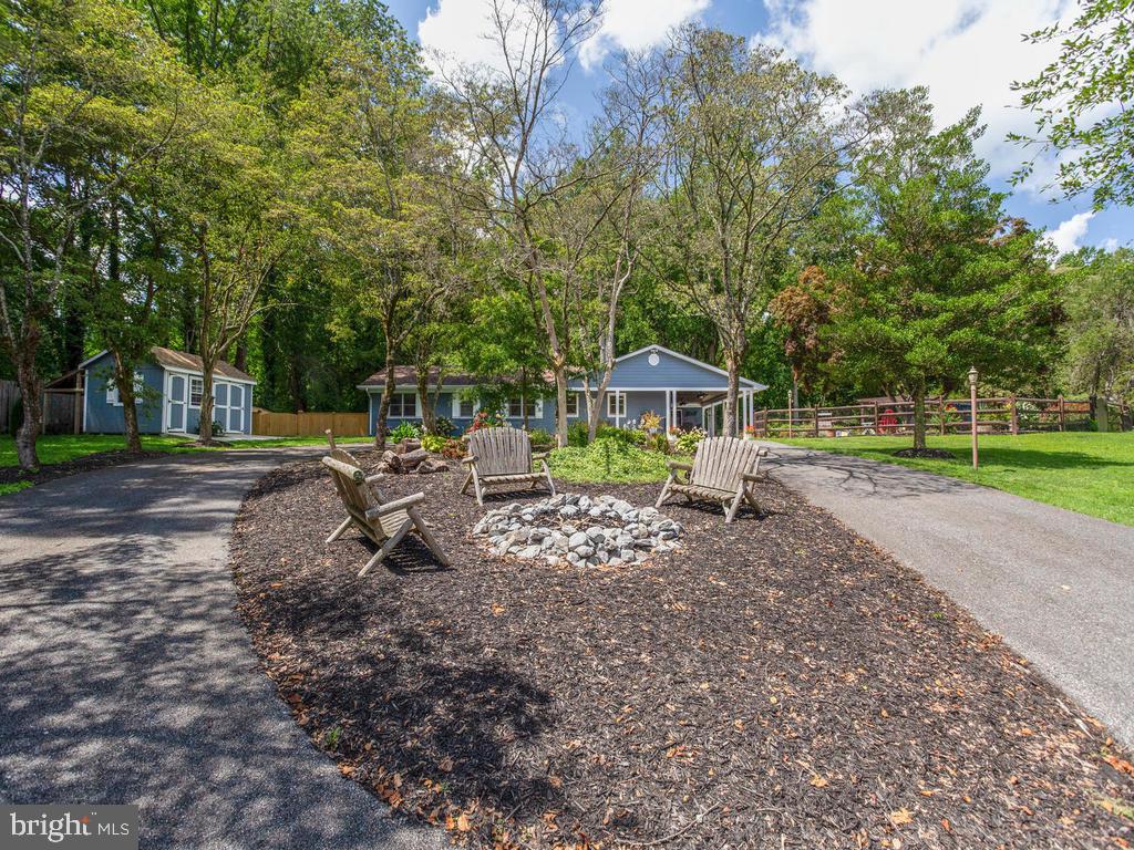 6678 Old Solomons Island Road Friendship, MD 20758 - Photo 9 of 57 Relax by the fire pit and grab a cold beverage