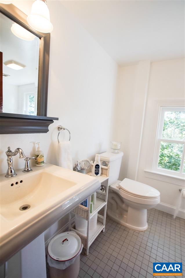 3759 Courthouse Road Louisa, VA 23093 - Photo 21 of 29 a bathroom with a sink a toilet and a mirror