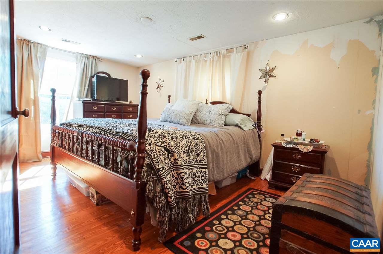 3759 Courthouse Road Louisa, VA 23093 - Photo 22 of 29 a bed room with a bed and a television