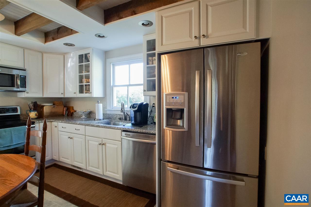 3759 Courthouse Road Louisa, VA 23093 - Photo 8 of 29 a kitchen with stainless steel appliances a refrigerator sink and cabinets