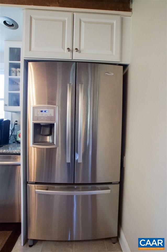 3759 Courthouse Road Louisa, VA 23093 - Photo 9 of 29 a close view of a refrigerator in kitchen with stainless steel appliances wooden floor and cabinets