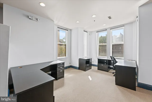 a kitchen with stainless steel appliances a refrigerator and a sink
