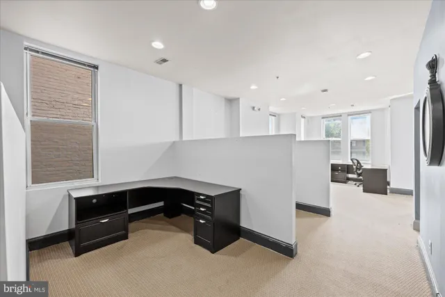 a kitchen with a white cabinets and sink